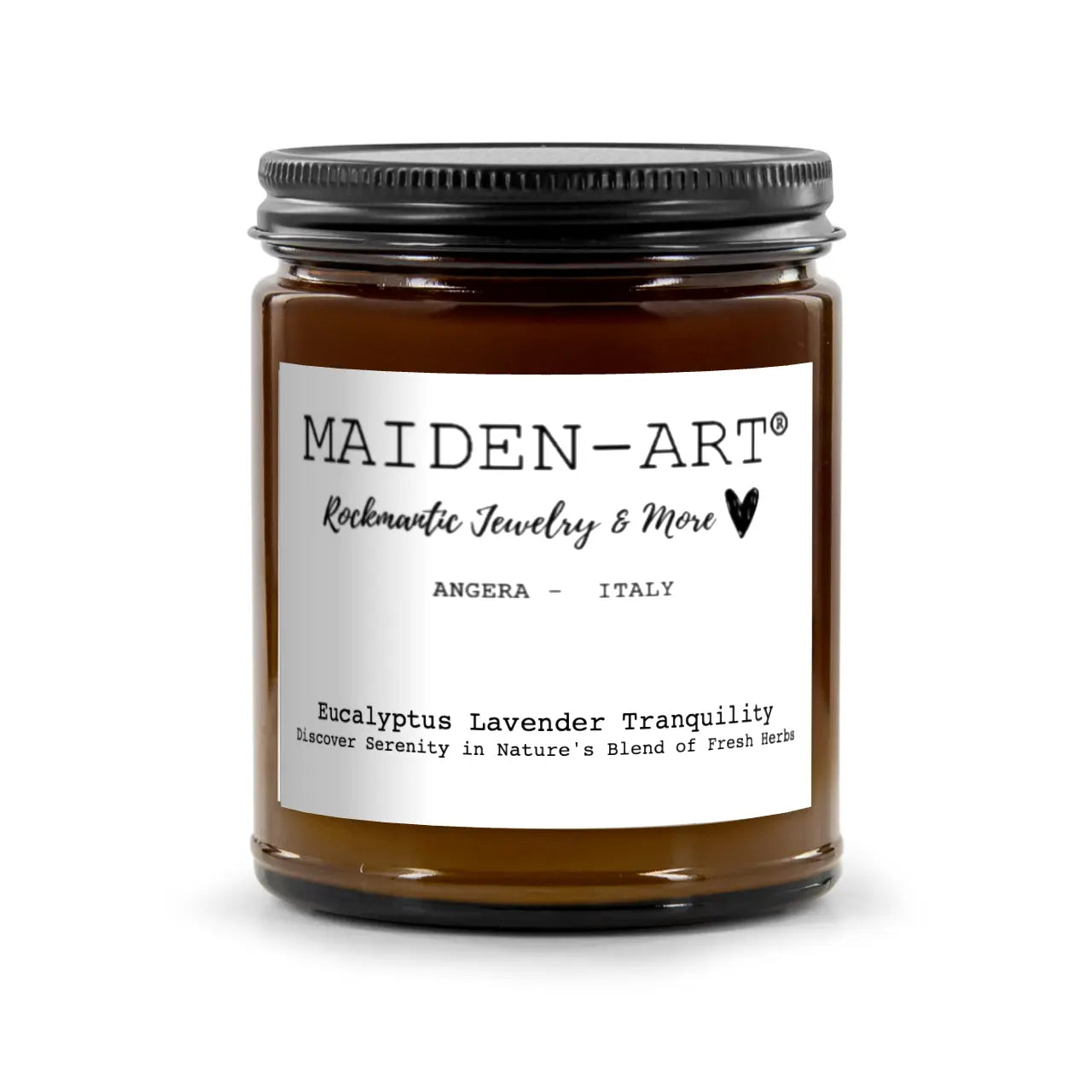 Brown candle jar with black lid and white label on a white background