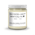 Candle jar with 'MAIDEN-ART' label on a white background