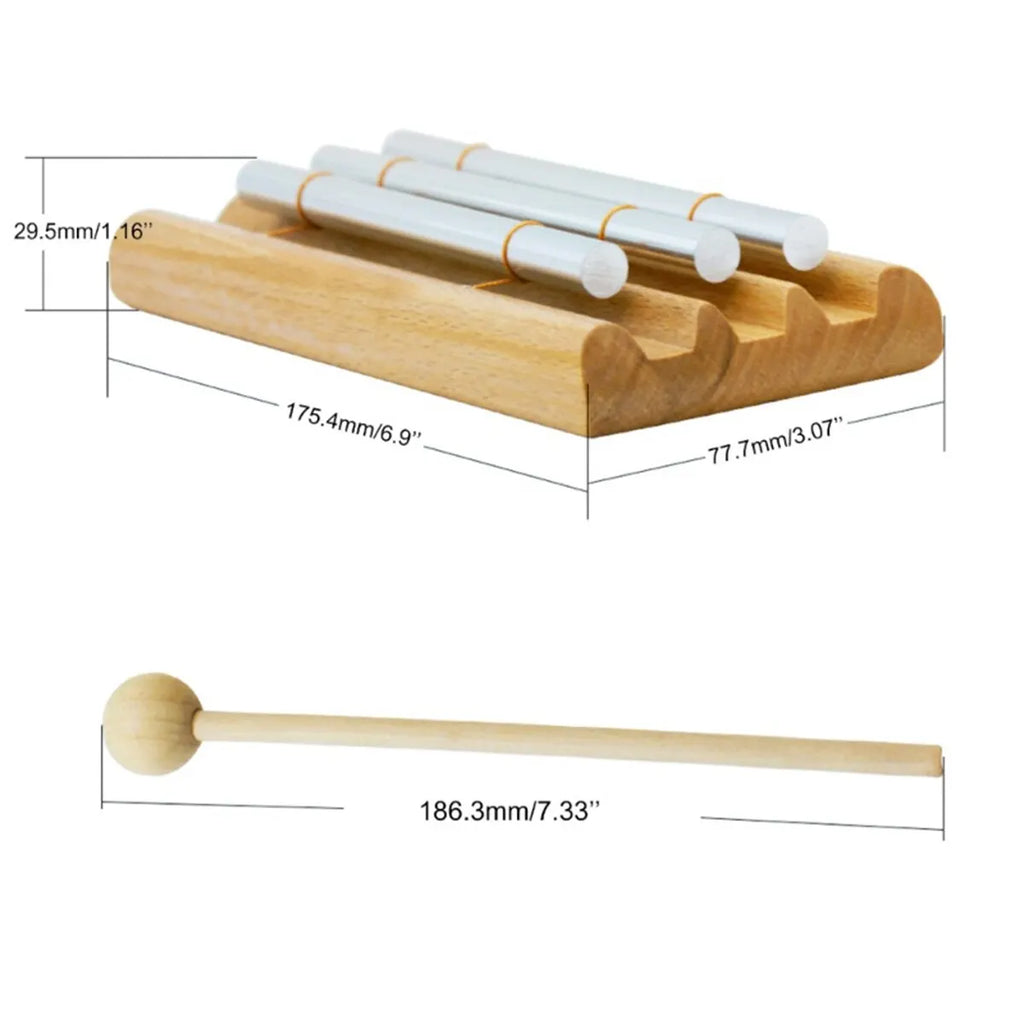 Wooden xylophone with mallets and measurements on a white background