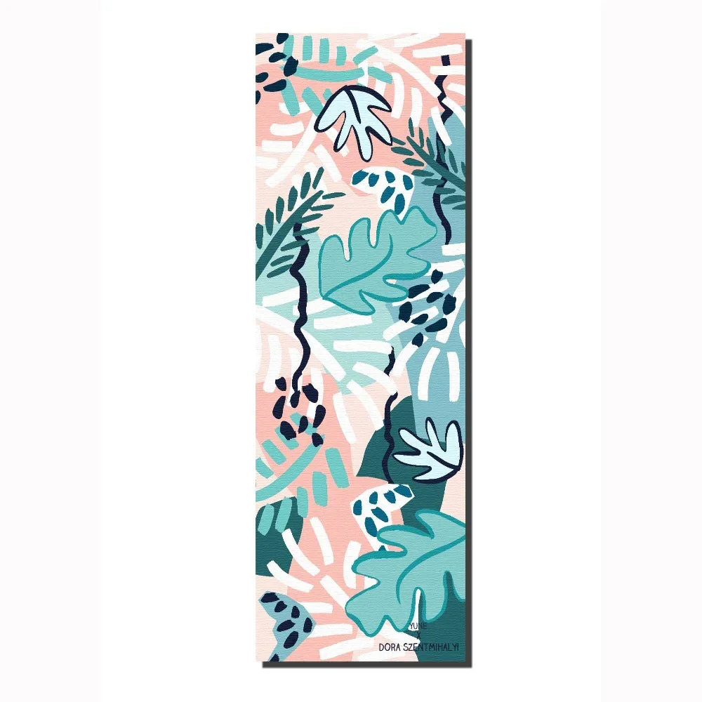 Yoga mat with tropical leaf pattern on a white background