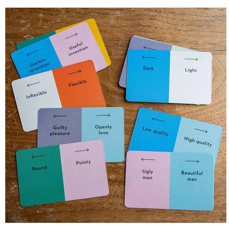 Colorful cards with black text on a wooden surface
