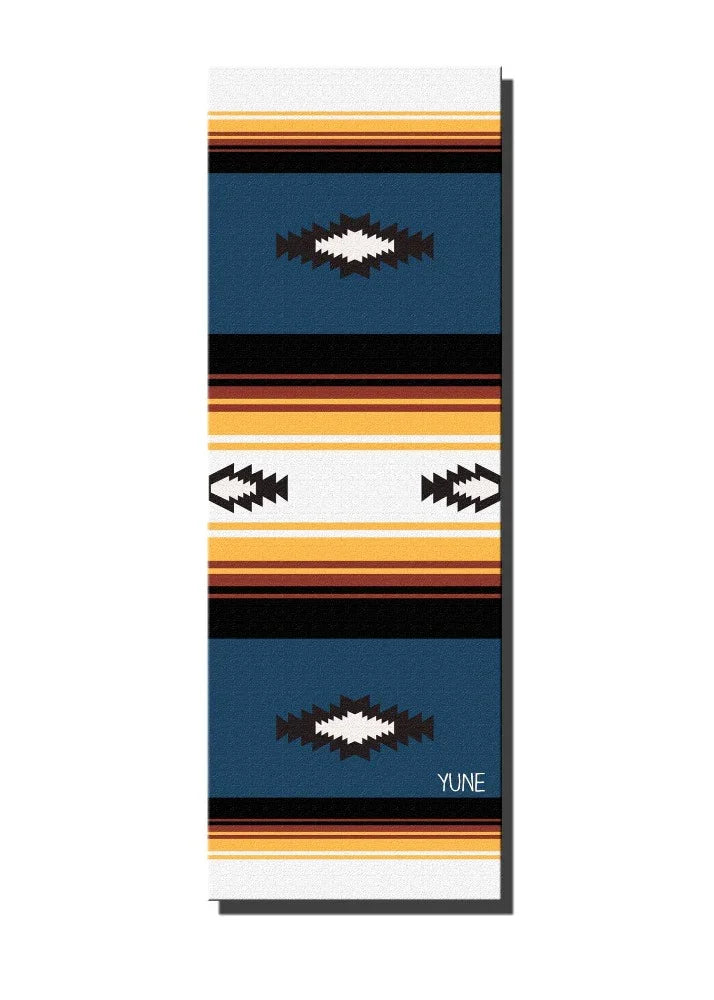 Towel with colorful striped pattern and brand logo on a white background